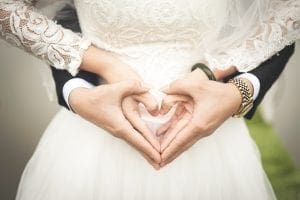 bride and groom heart hands